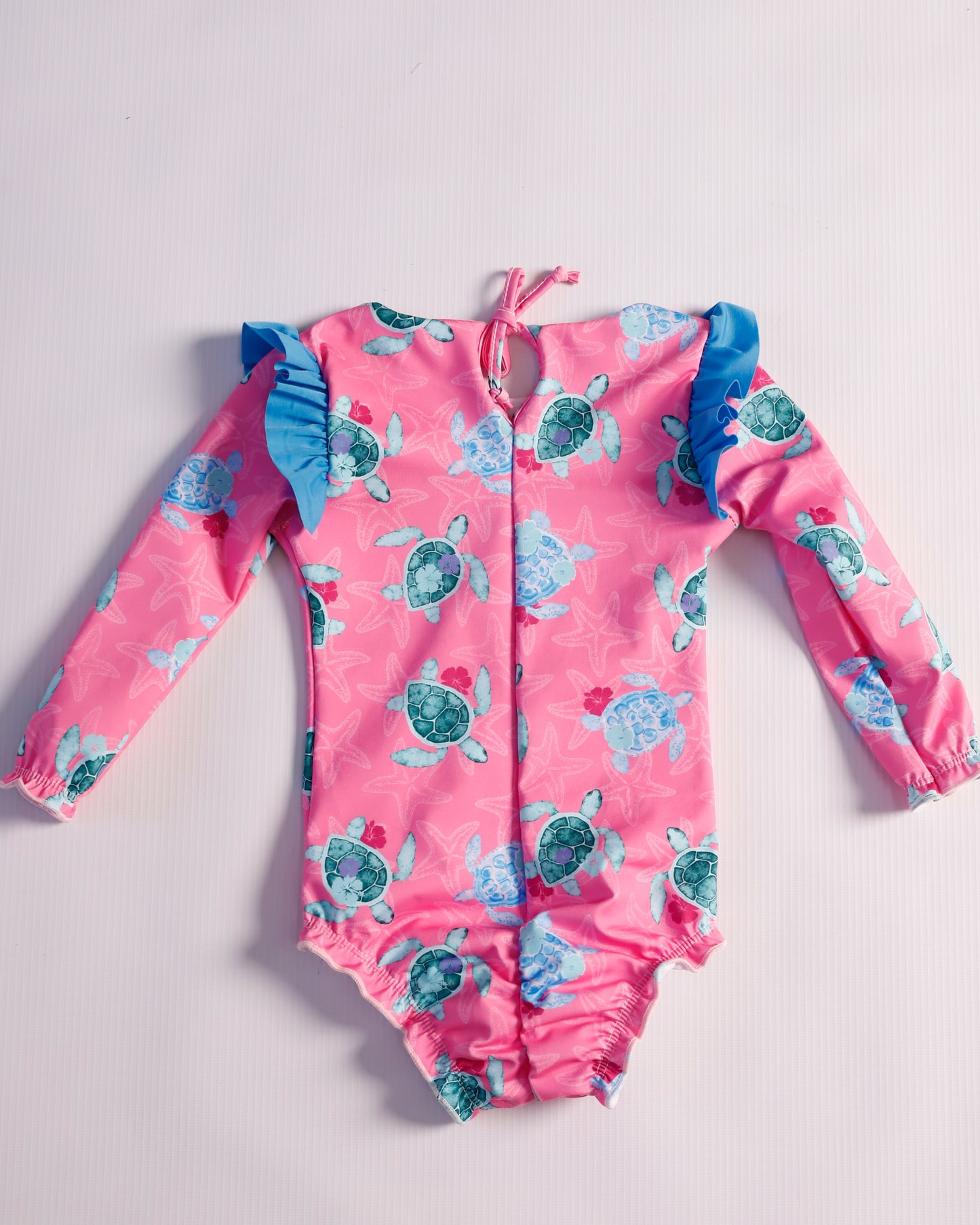 VESTIDO DE BAÑO FUCSIA TORTUGAS