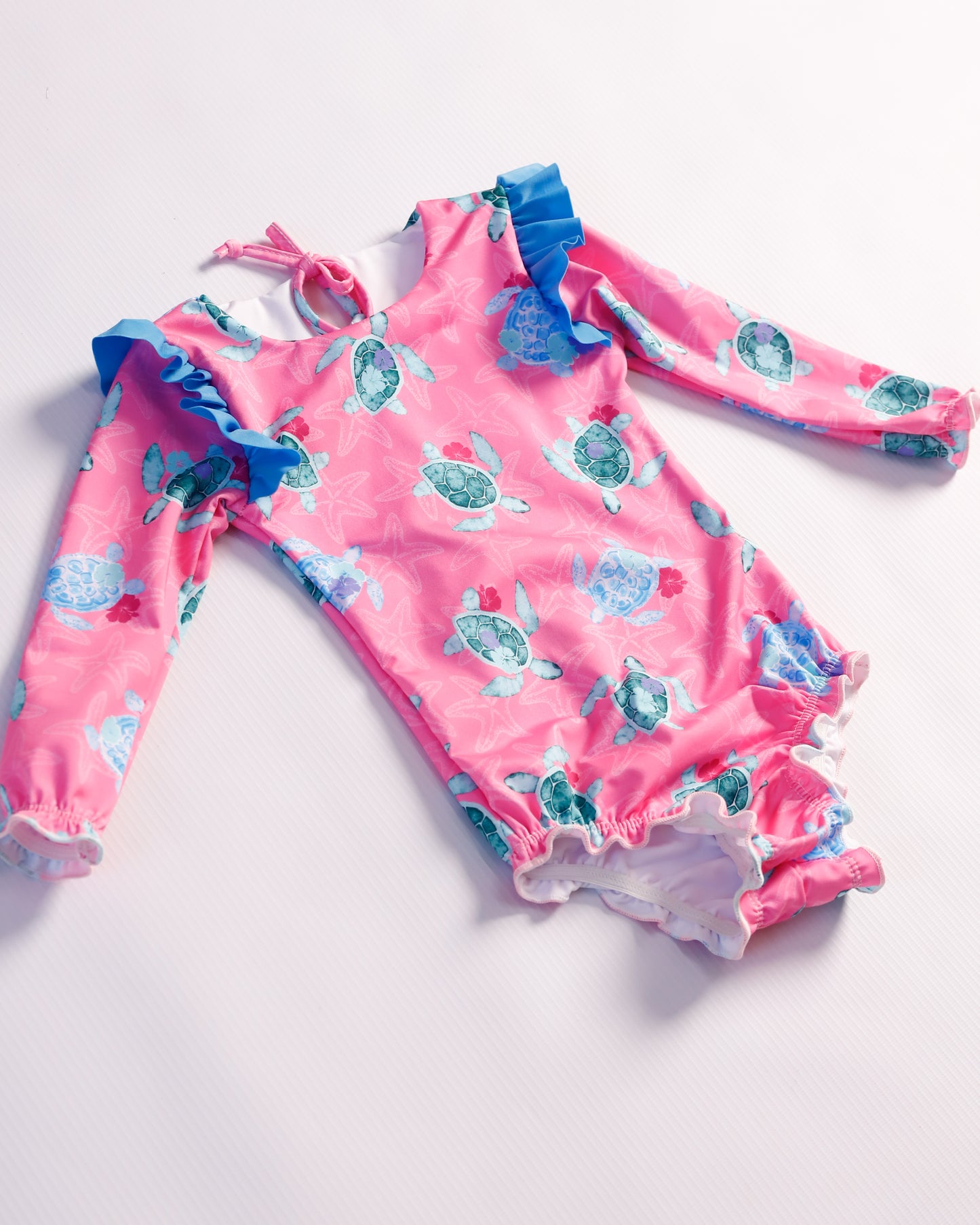 VESTIDO DE BAÑO FUCSIA TORTUGAS