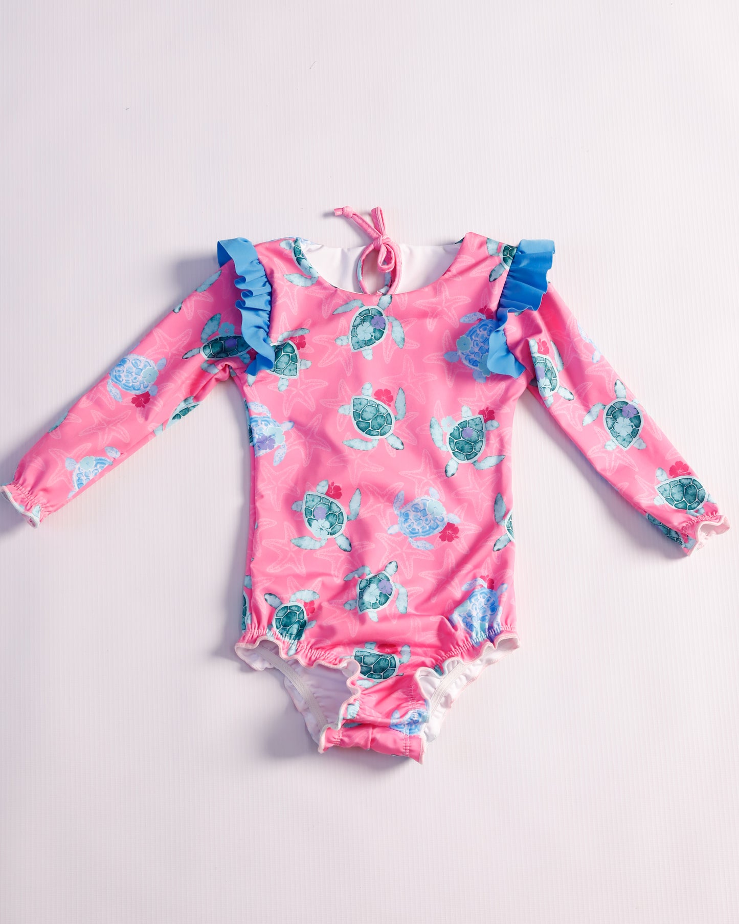 VESTIDO DE BAÑO FUCSIA TORTUGAS
