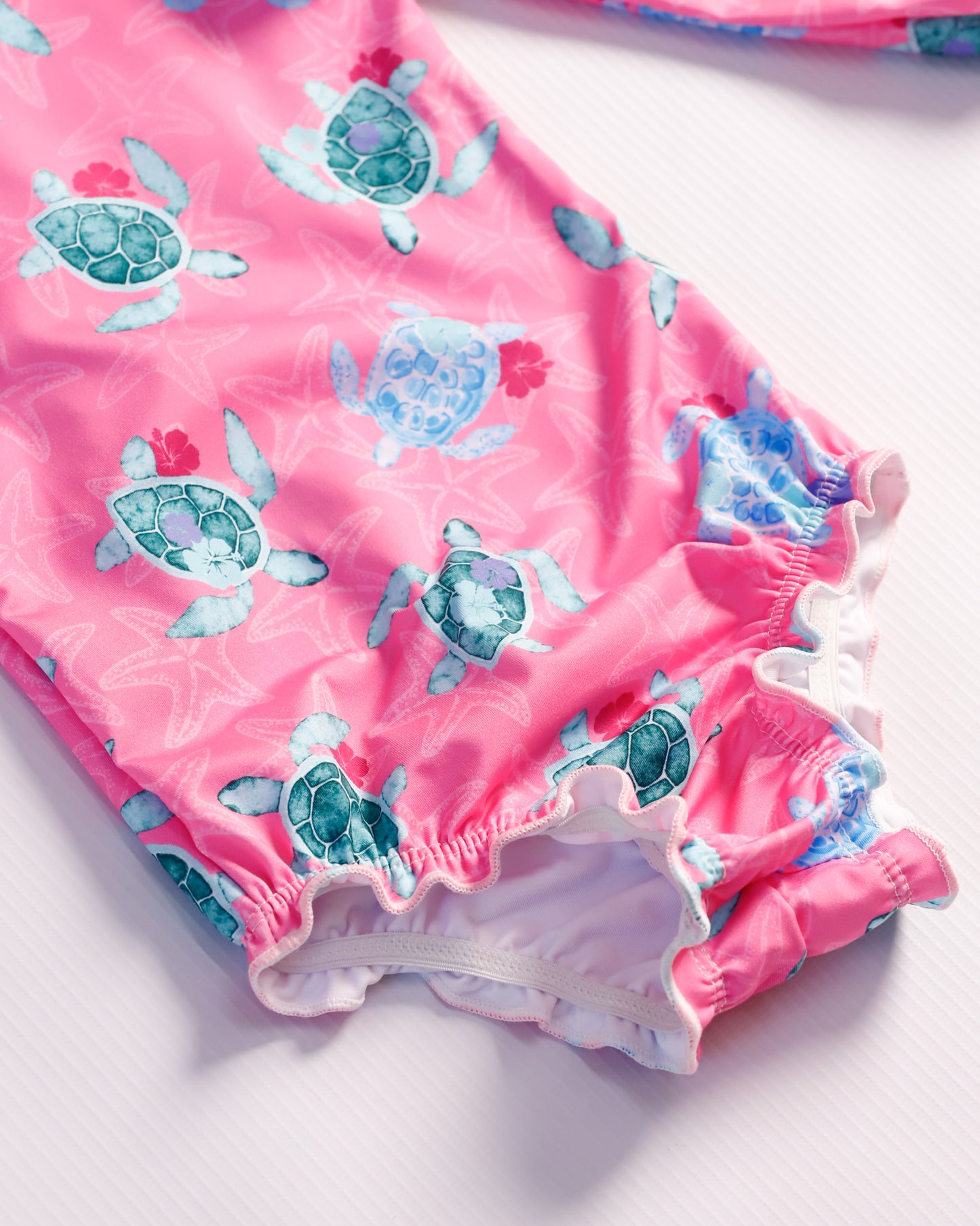 VESTIDO DE BAÑO FUCSIA TORTUGAS