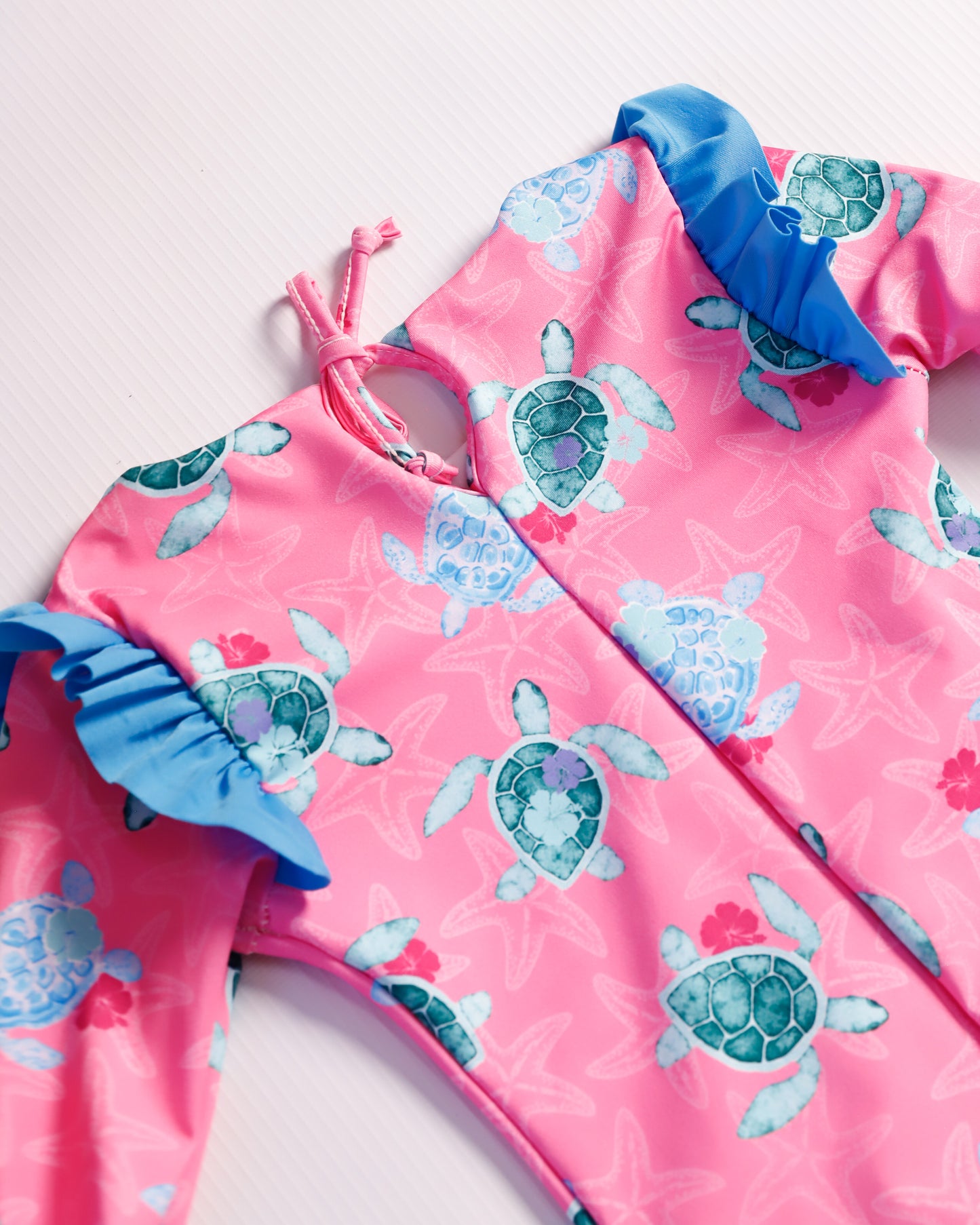 VESTIDO DE BAÑO FUCSIA TORTUGAS