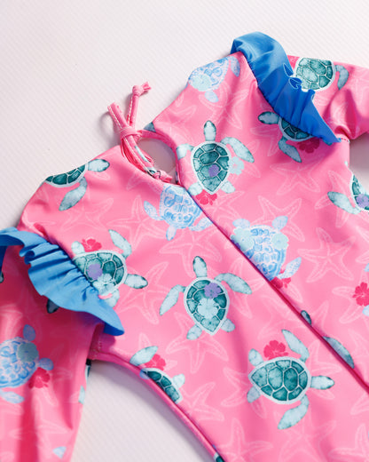 VESTIDO DE BAÑO FUCSIA TORTUGAS